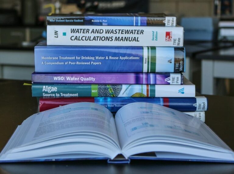 Image of a stack of library books about water quality and treatment